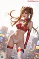 A woman in a red and white bikini standing in the middle of a city.