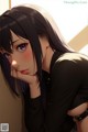 Anime girl with long black hair and purple eyes.