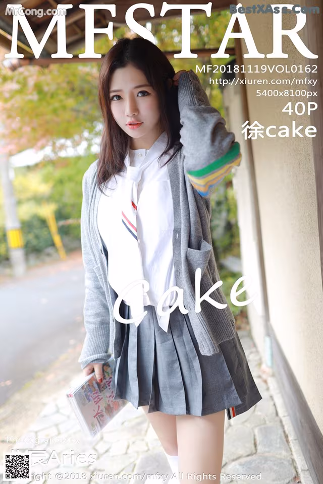 A young woman in a school uniform posing for a magazine cover.